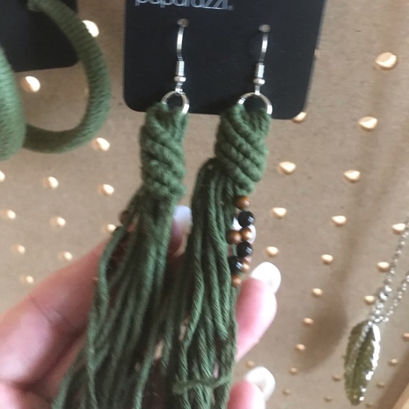 Long earrings in dk sage green yarn. Accent beads